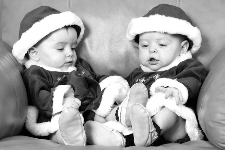 Twins in Santa uniform by Sharif Mohammadi
